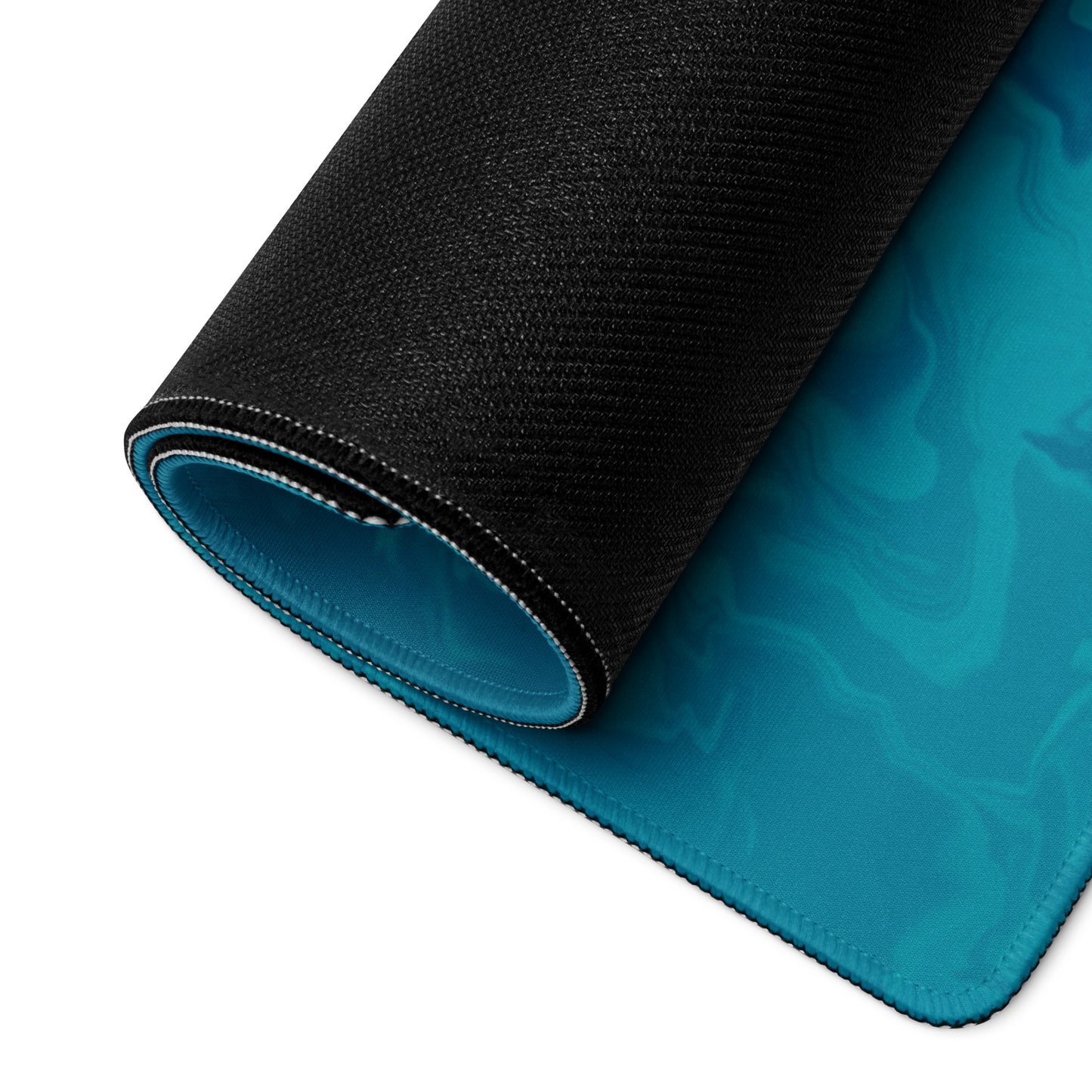A 36" x 18" desk pad with a man wearing a skull gas mask breathing smoke out from it rolled up. Blue in color.