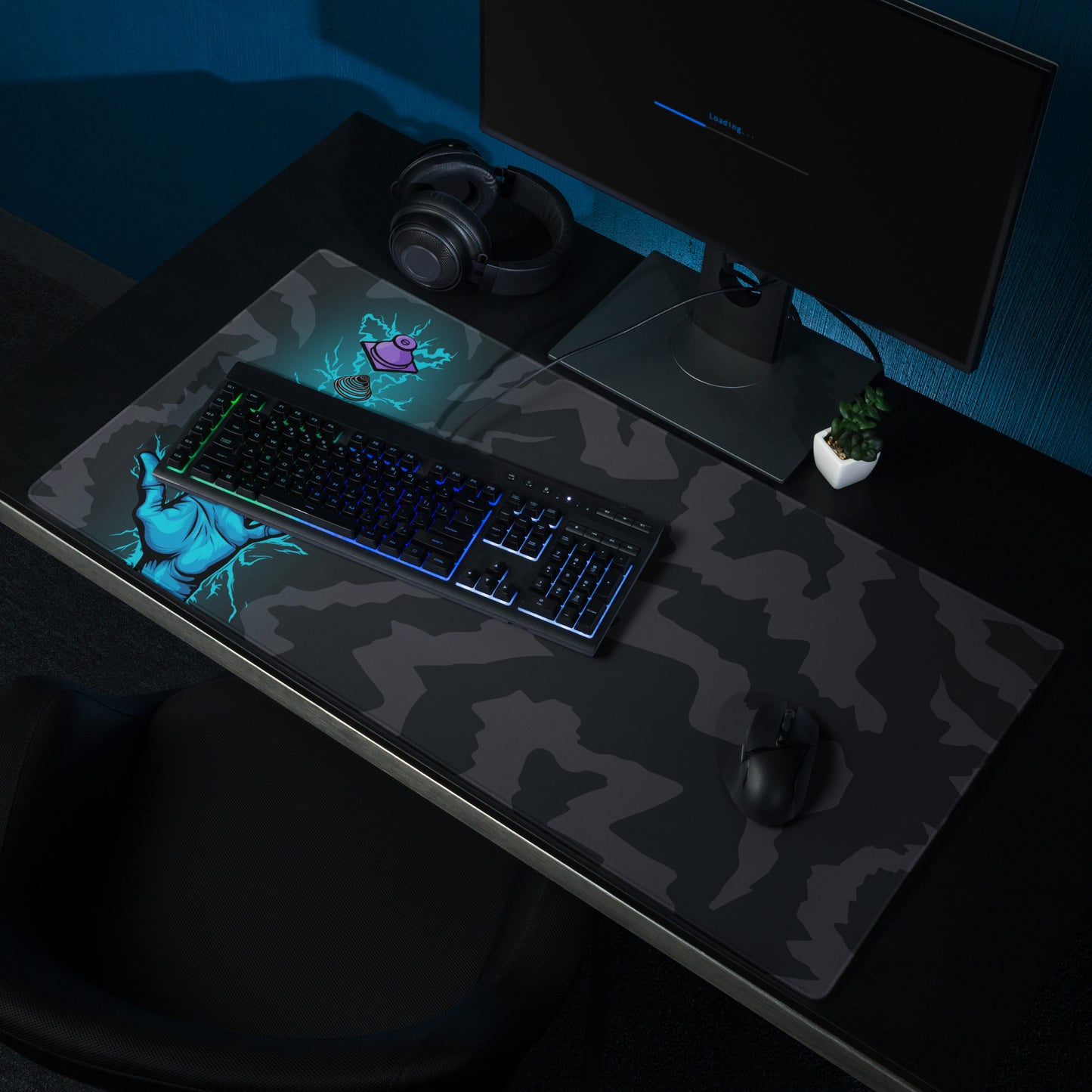 A 36" x 18" desk pad with a hand touching a deconstructed Topre switch surrounded by electricity shown on a desk setup. Black and Charcoal in color.