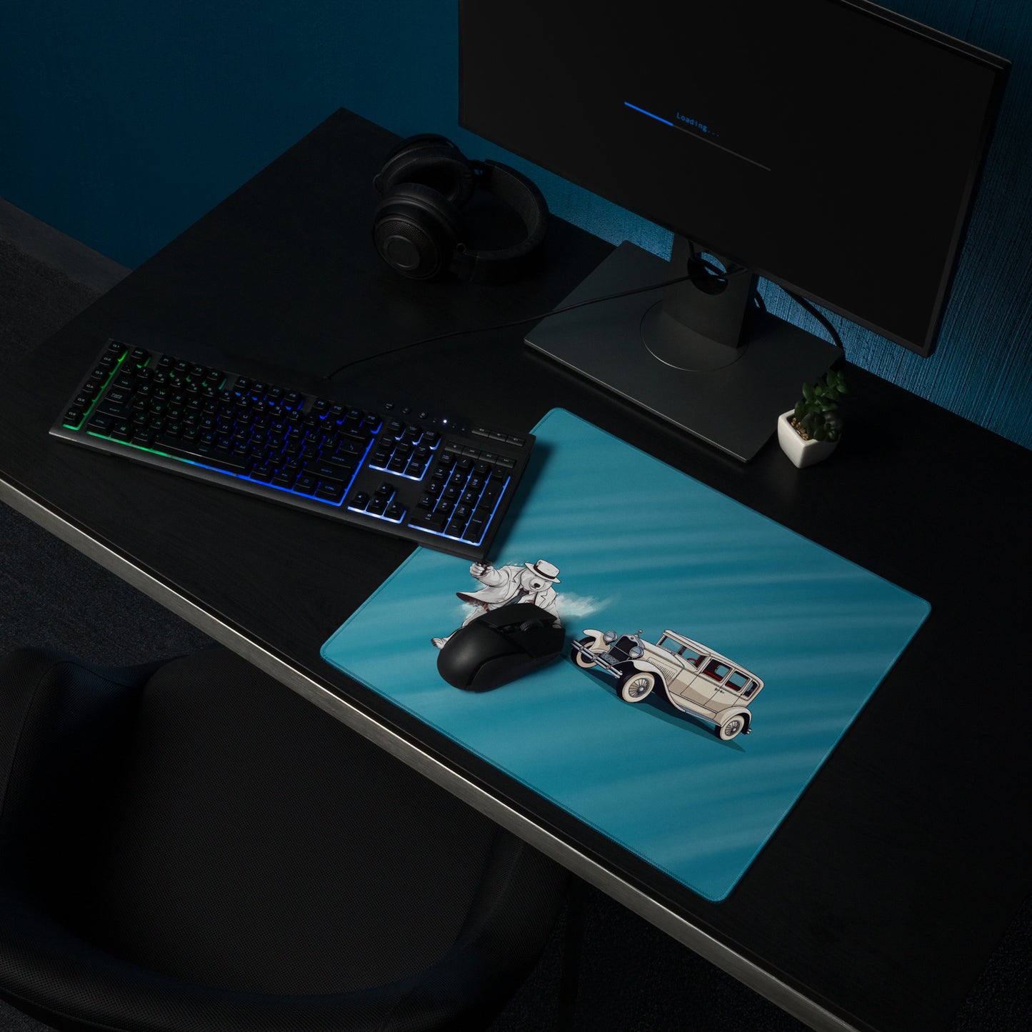 An 18" x 16" mouse pad with a gangster polar bear and his car shown on a desk setup. Blue in color.
