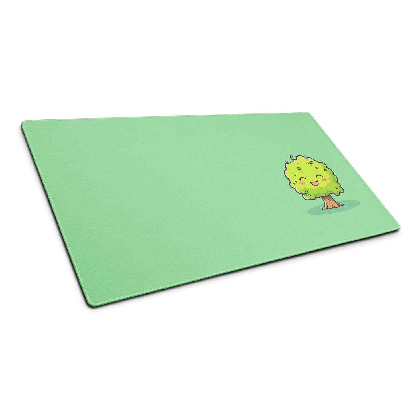 A 36" x 18" desk pad with a cute tree on it shown at an angle. Green in color.