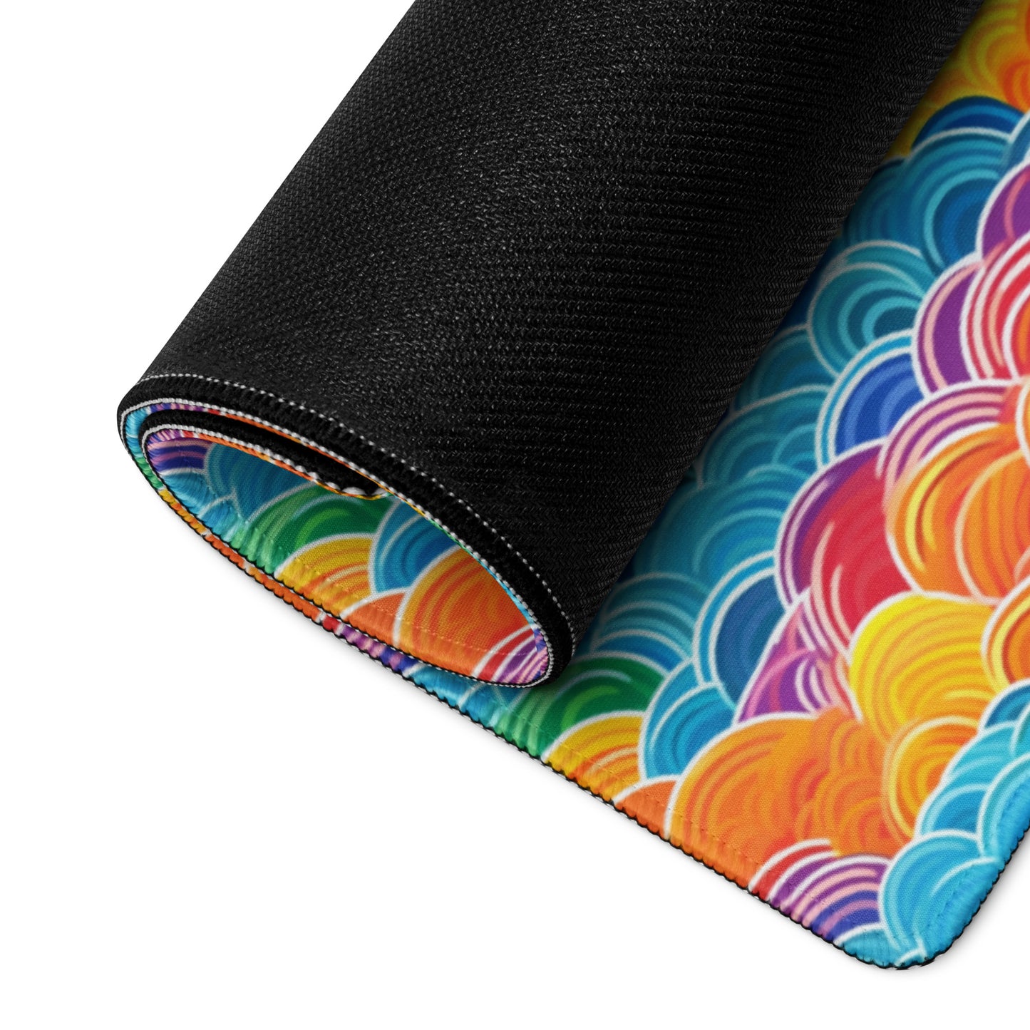 A 36" x 18" desk pad with bubbly swirly clouds all over it rolled up. Rainbow colored.