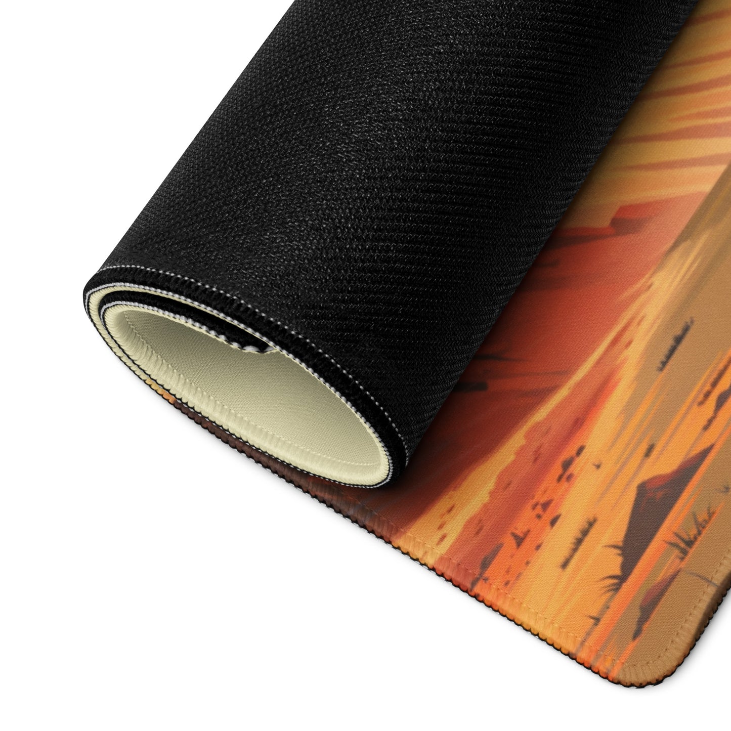 A 36" x 18" gaming desk pad with a Rally car racing through the desert rolled up. Brown and Beige in Color.