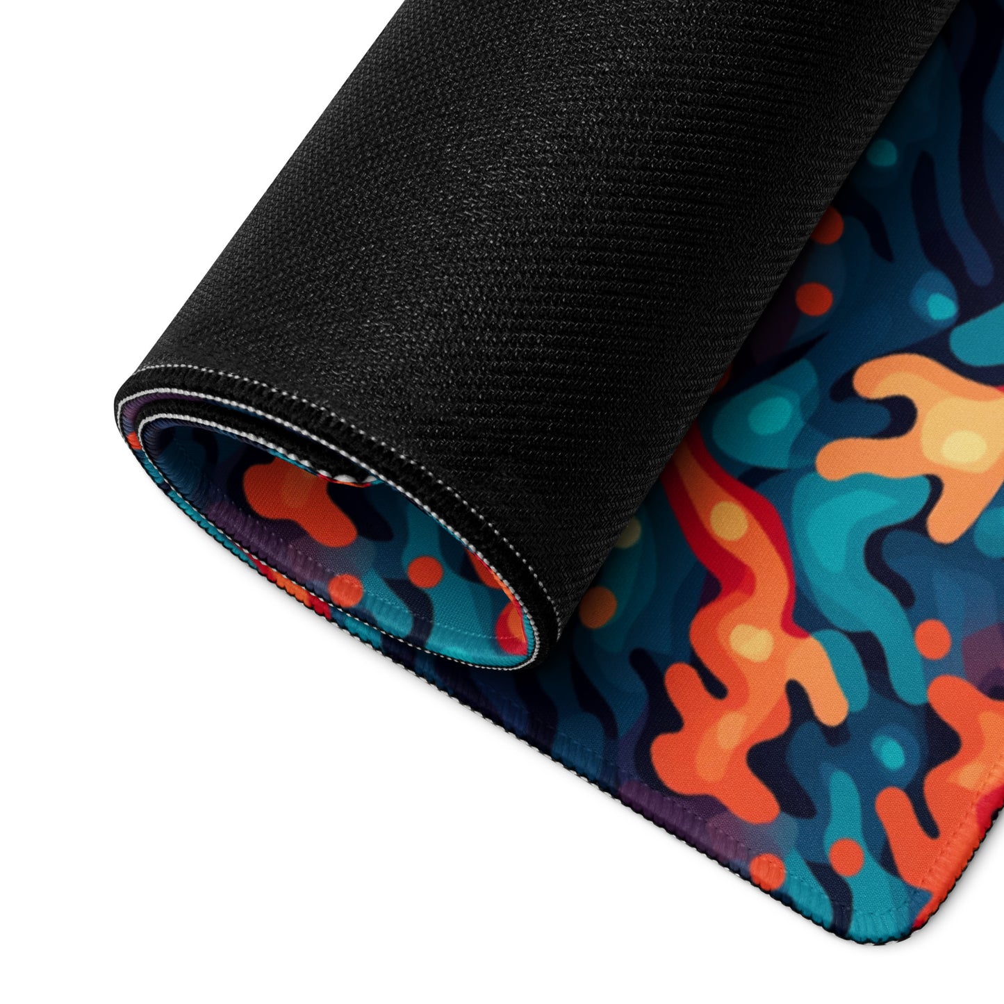 A 36" x 18" desk pad with a wavy woven pattern on it rolled up. Red and Blue in color.