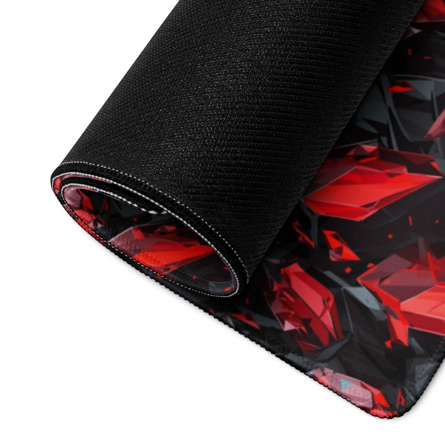 A black and red crystal gaming desk pad rolled up.
