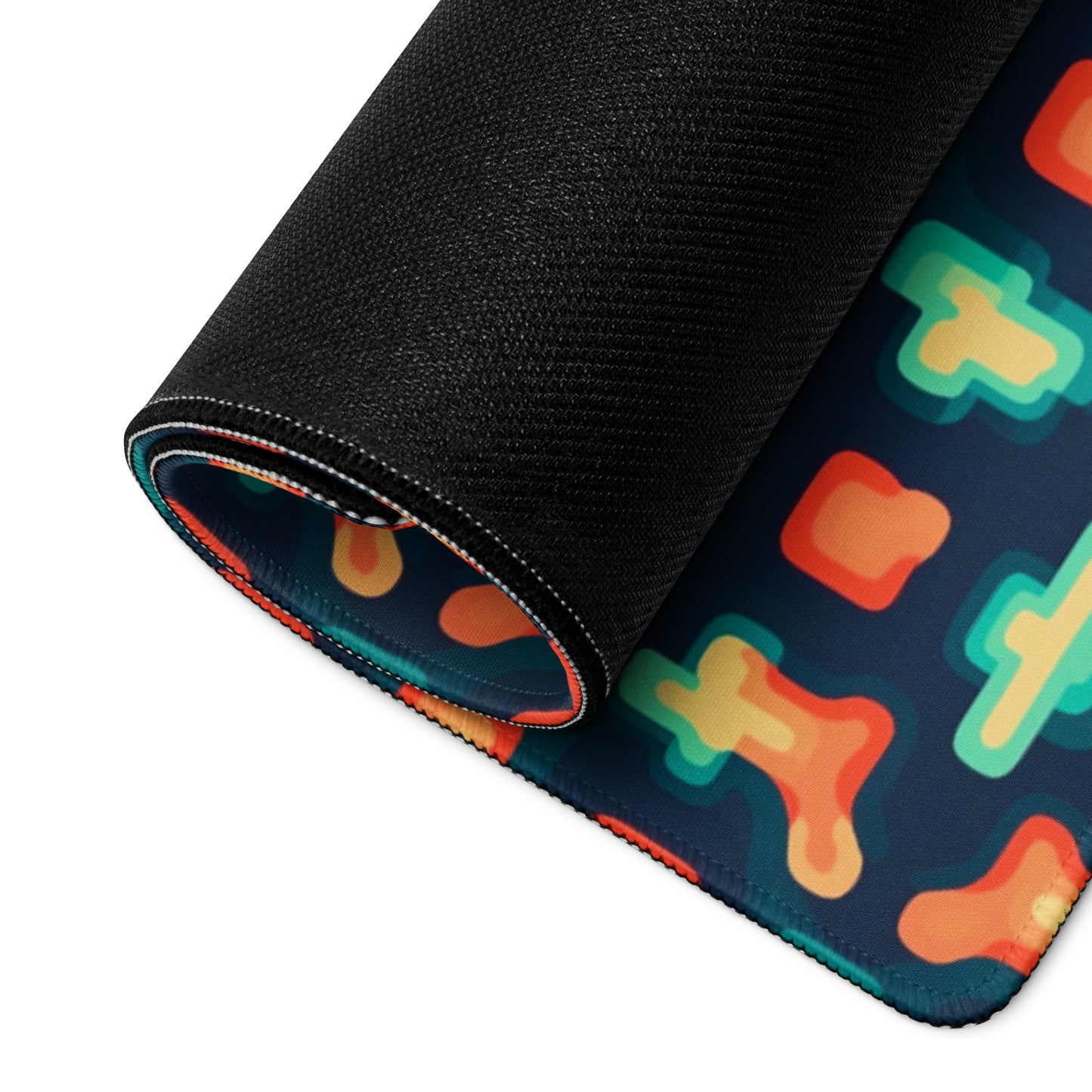 A broken puzzle gaming desk pad rolled up.