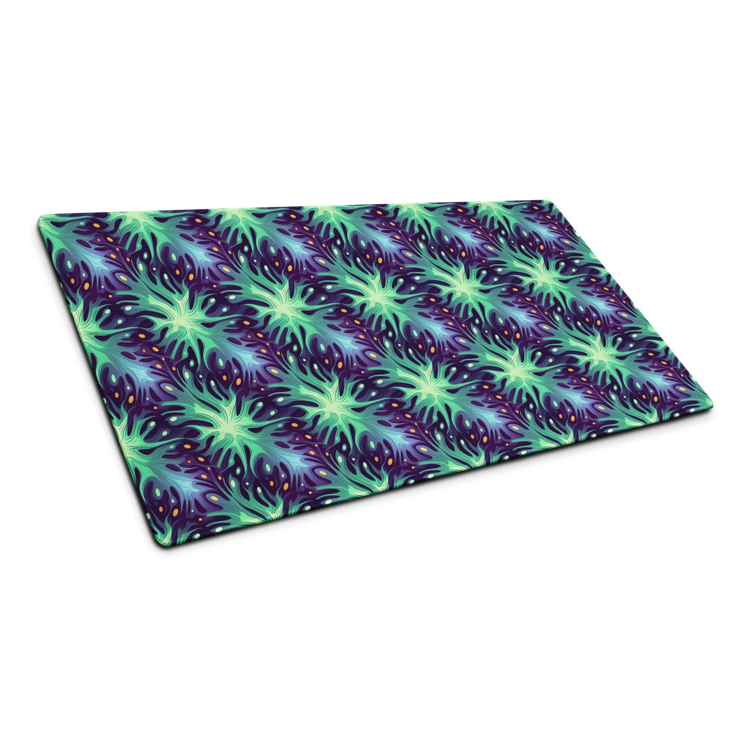 A 36" x 18" desk pad with a green and blue abstract pattern sitting at an angle.