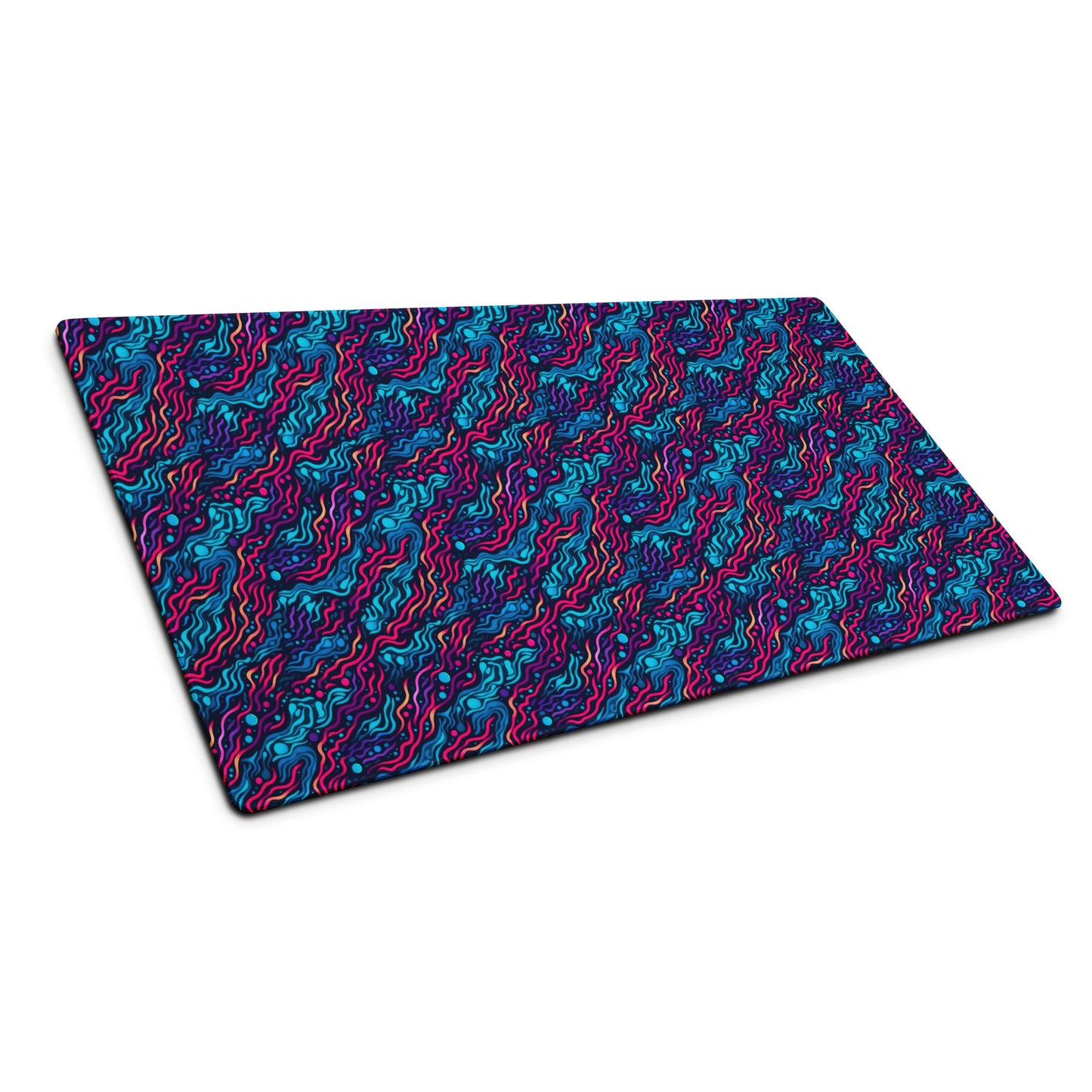 A 36" x 18" desk pad with wavy blue and pink pattern sitting at an angle.