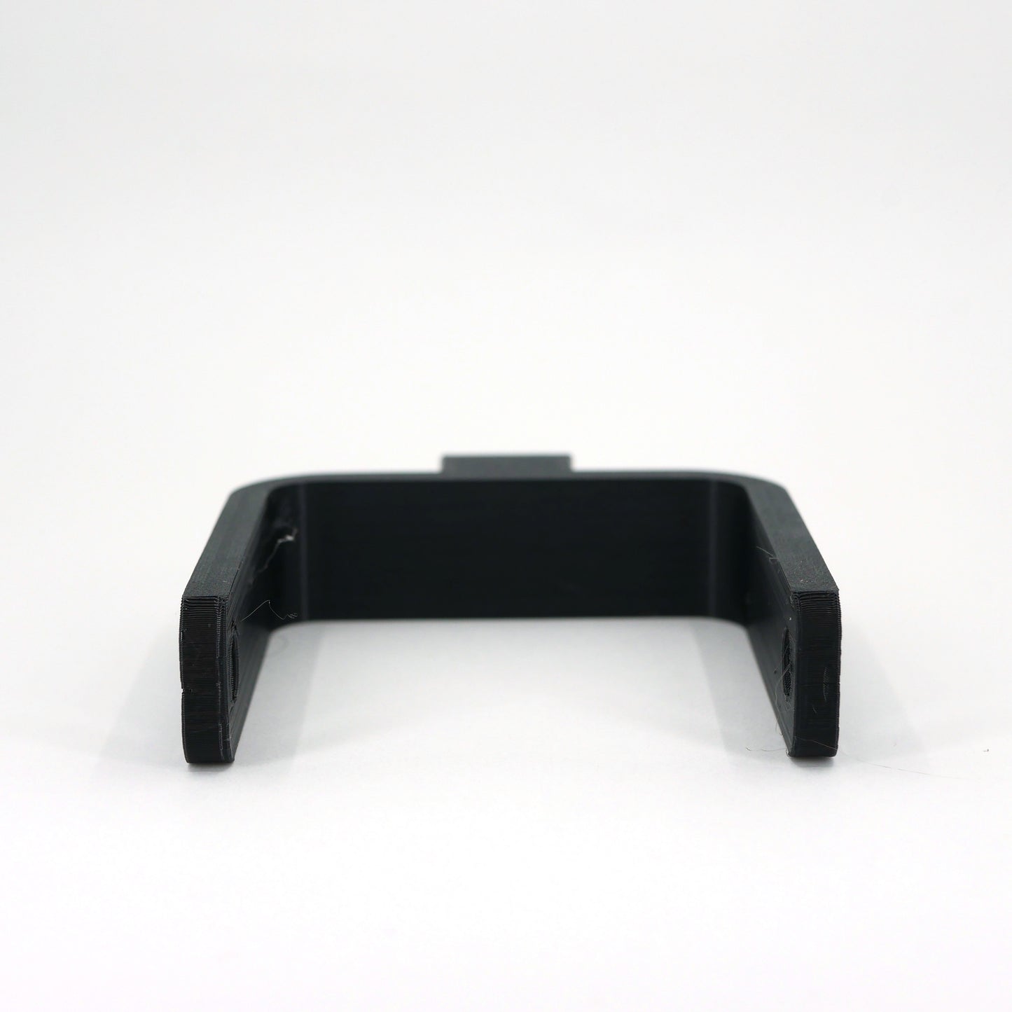 The front of a black microphone mount for the Elgato Wave microphone.