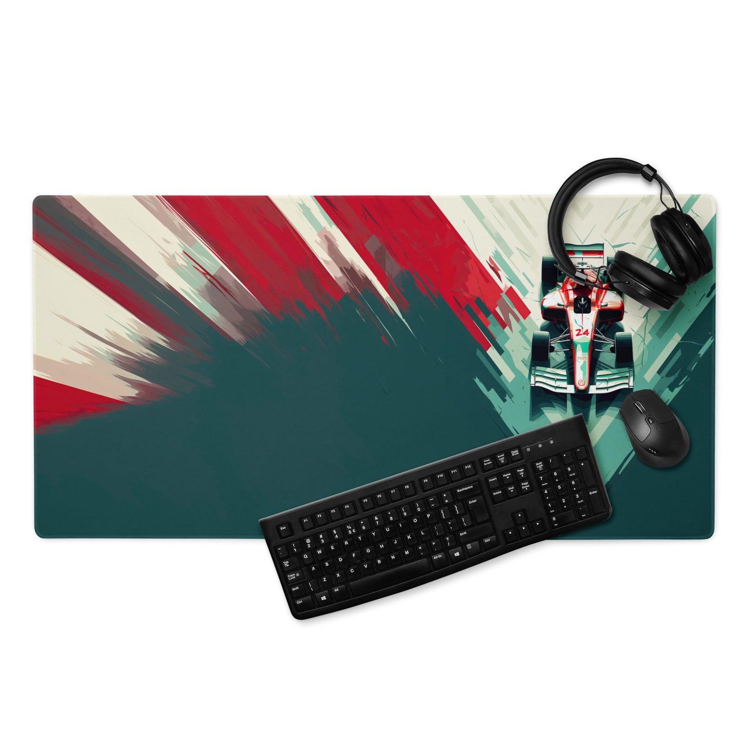 A 36" x 18" teal, red, and white desk pad with a formula one car on the right. With a keyboard, mouse, and headphones sitting on it.