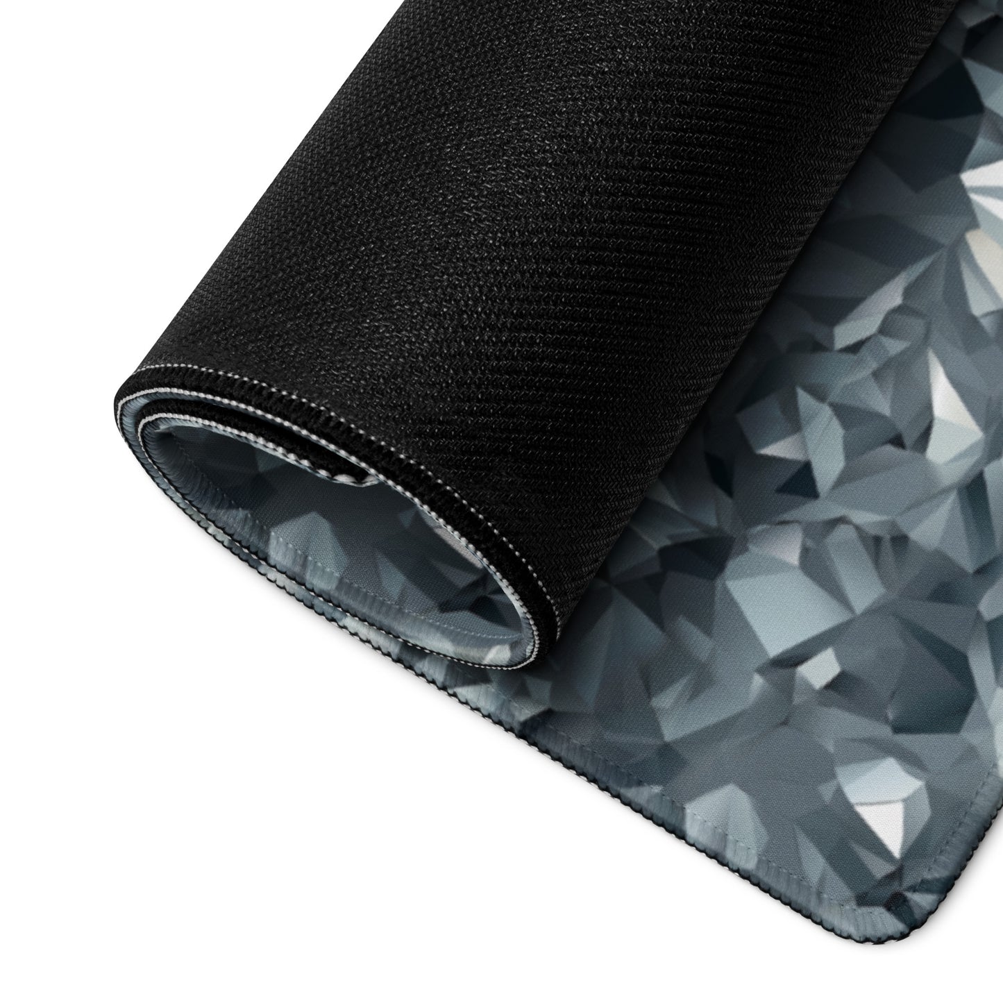 A gray crystal gaming desk pad rolled up.