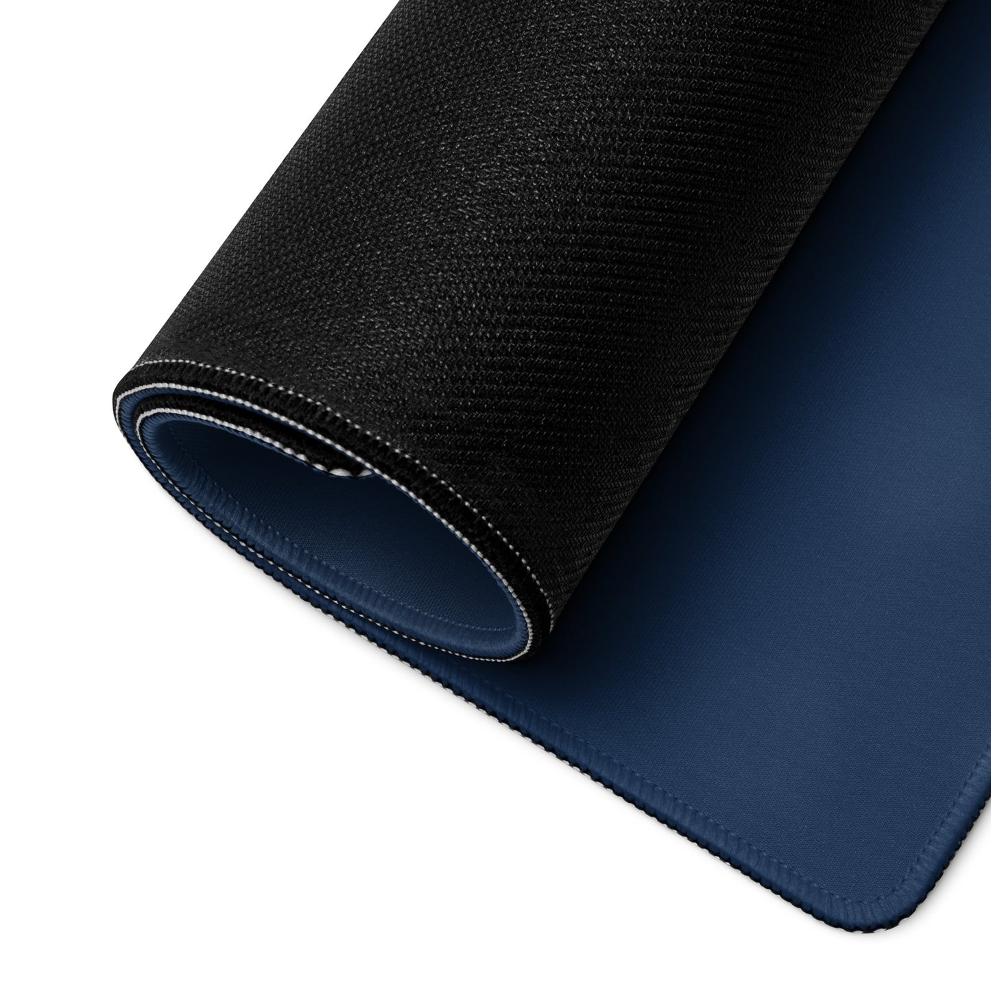 A 36" x 18" blue desk pad with a girl in a hoodie rolled up.
