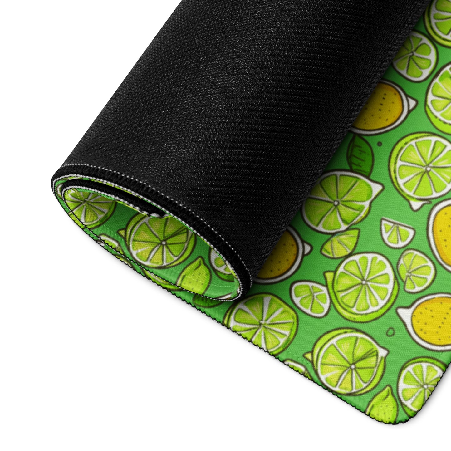 A lemons and limes gaming desk pad rolled up.