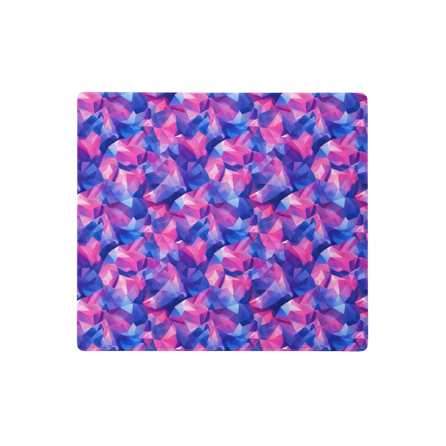 An 18" x 16" gaming desk pad with pink and blue crystals.