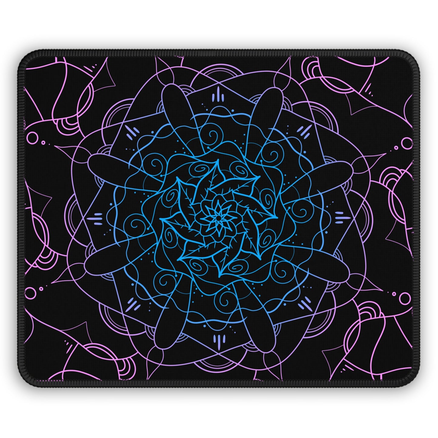 A gaming mouse pad with a pink and blue mandala pattern on a black background.