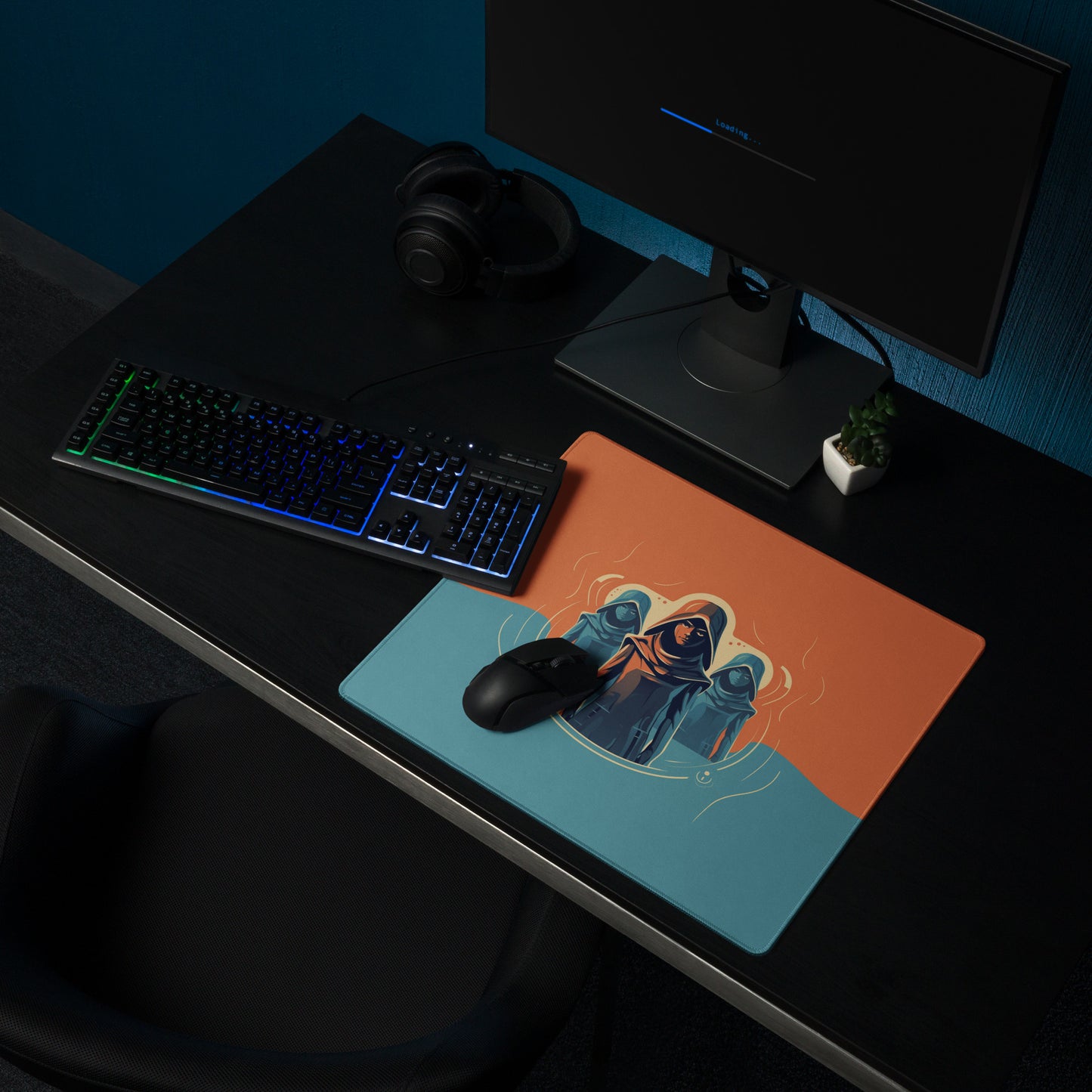 A 18" x 16" orange and blue desk pad with three robed figures sitting on a desk.