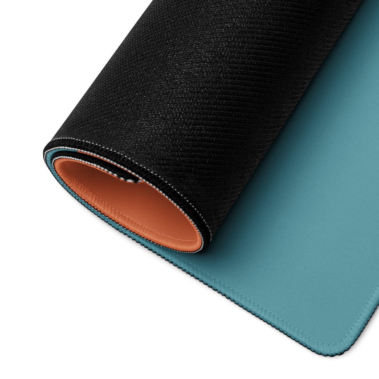 A 36" x 18" orange and blue desk pad with three robed figures rolled up.