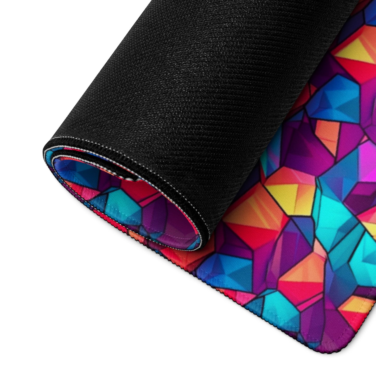 A stained glass crystal gaming desk pad rolled up.