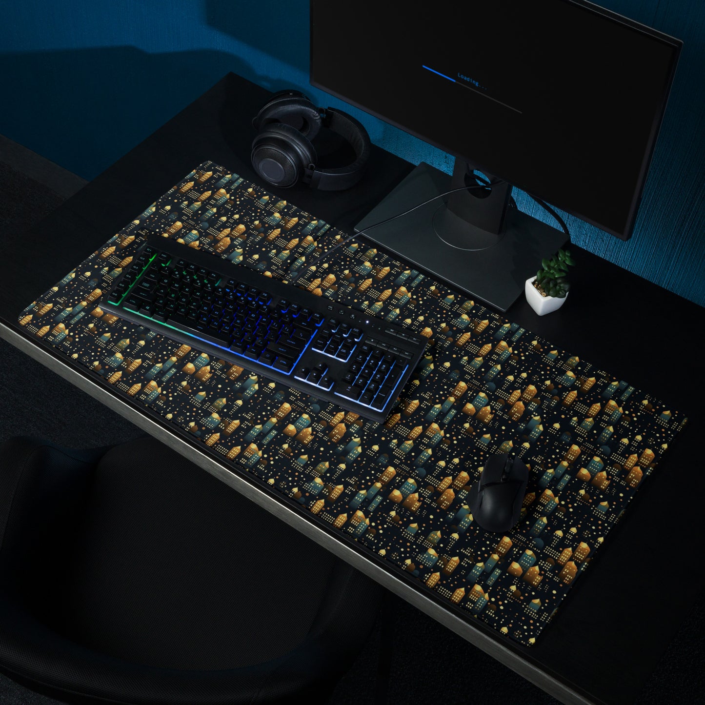 A 36" x 18" desk pad with a stary city pattern sitting on a desk.