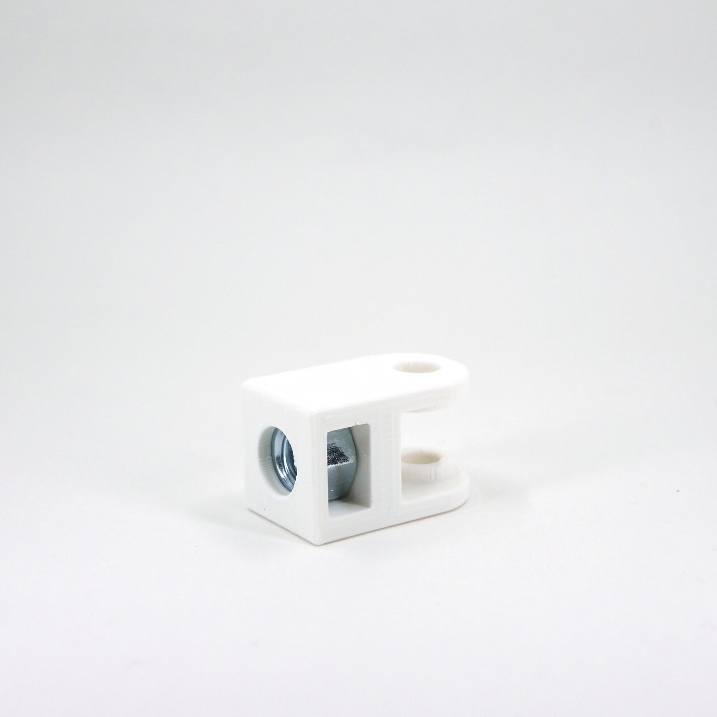 The front of a white HyperX QuadCast microphone mount adapter.