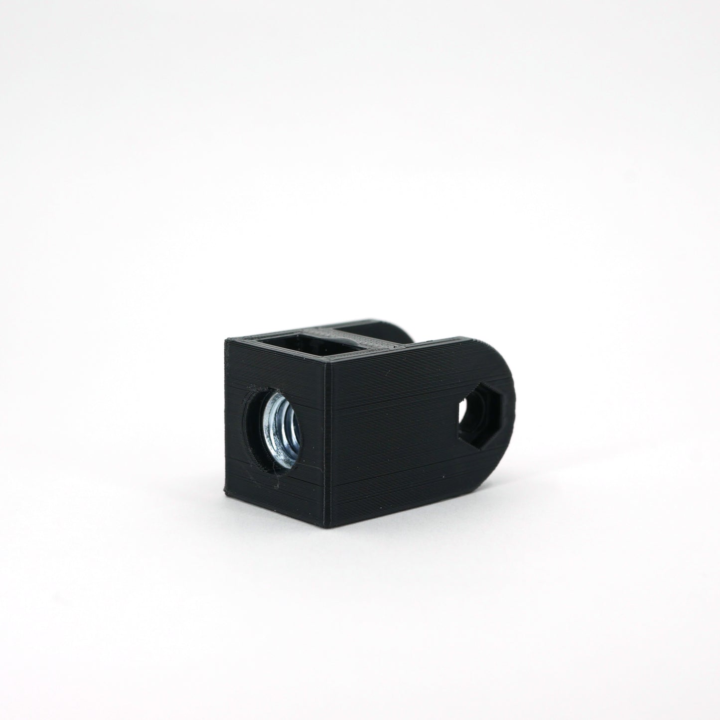 A black HyperX SoloCast microphone mount adapter sitting at an angle.