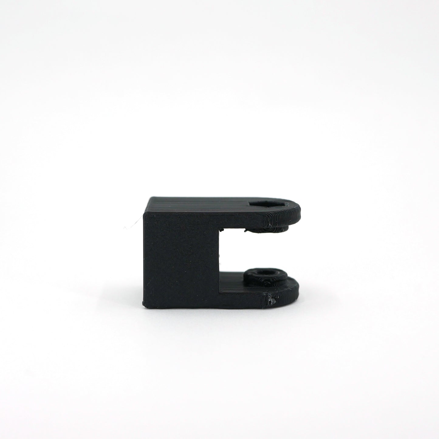 The back of a black HyperX SoloCast microphone mount adapter.