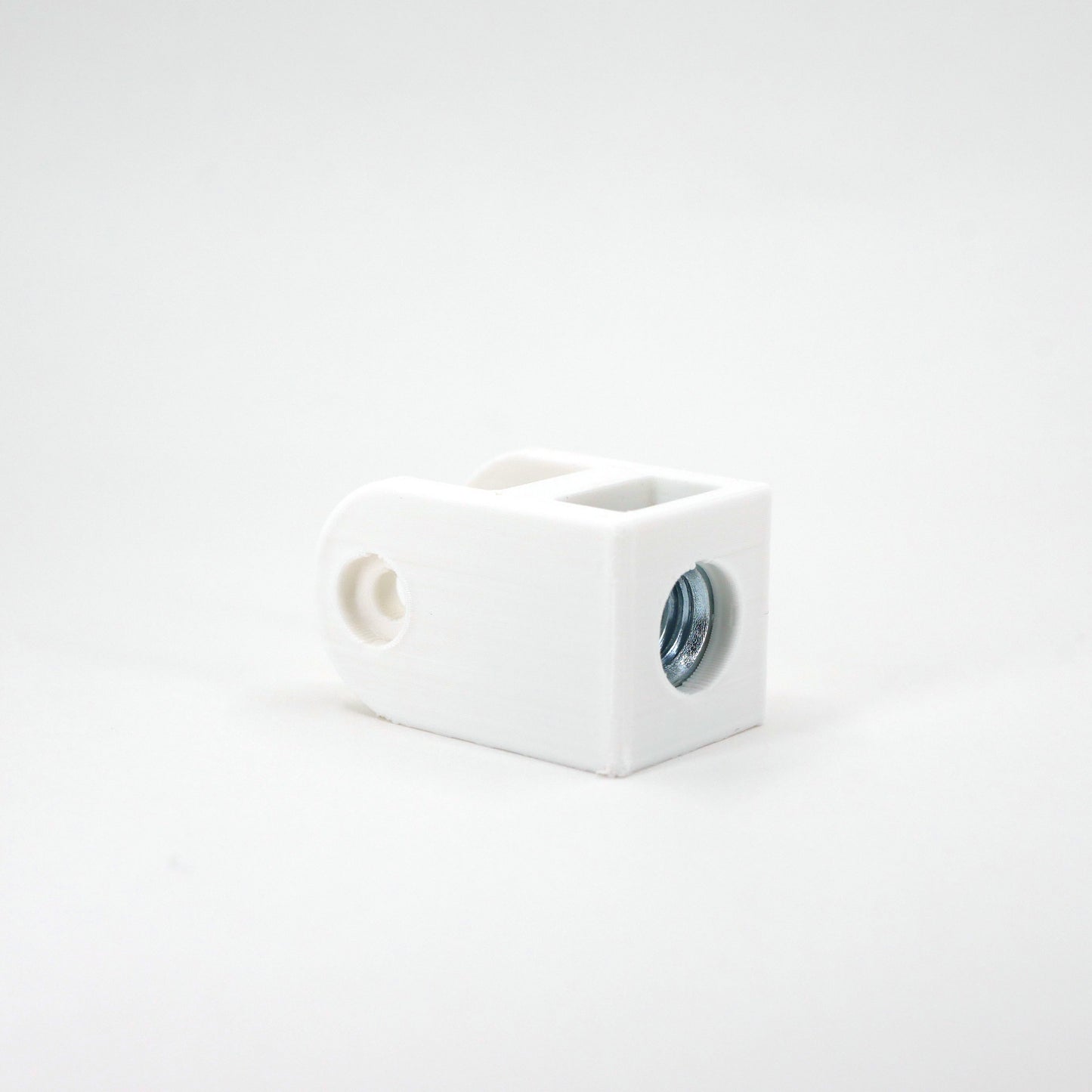 A white HyperX SoloCast microphone mount adapter sitting at an angle.