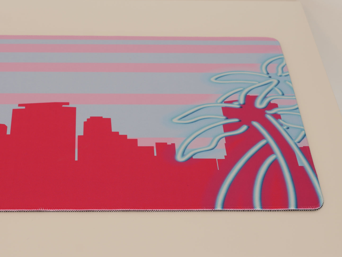 Right side of the pink and blue Miami skyline desk mat.