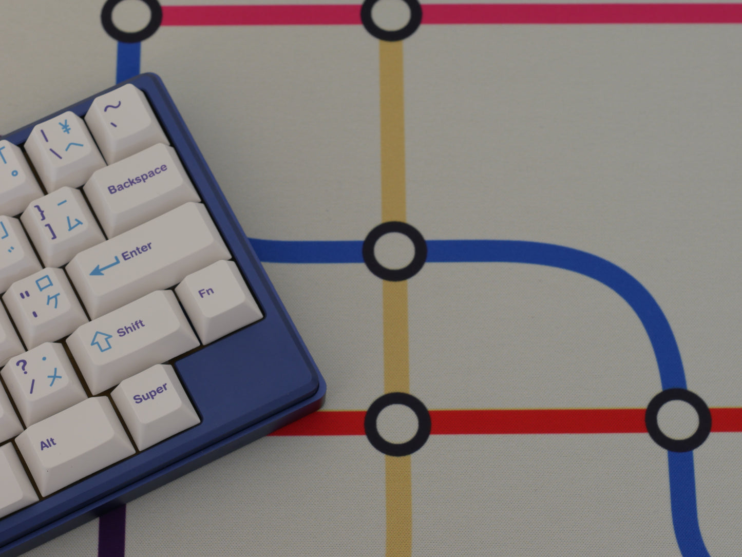 The middle of the subway transit desk mat with a white background and colorful lines.