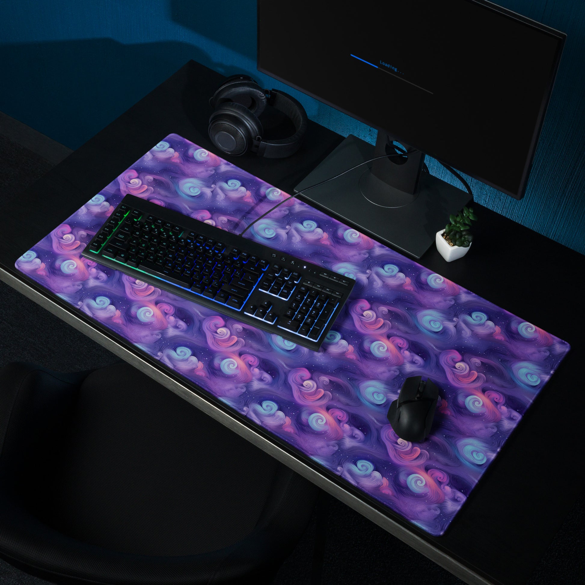 A 36" x 18" desk pad with fluffy clouds and stars on it shown on a desk setup. Blue and Purple in color