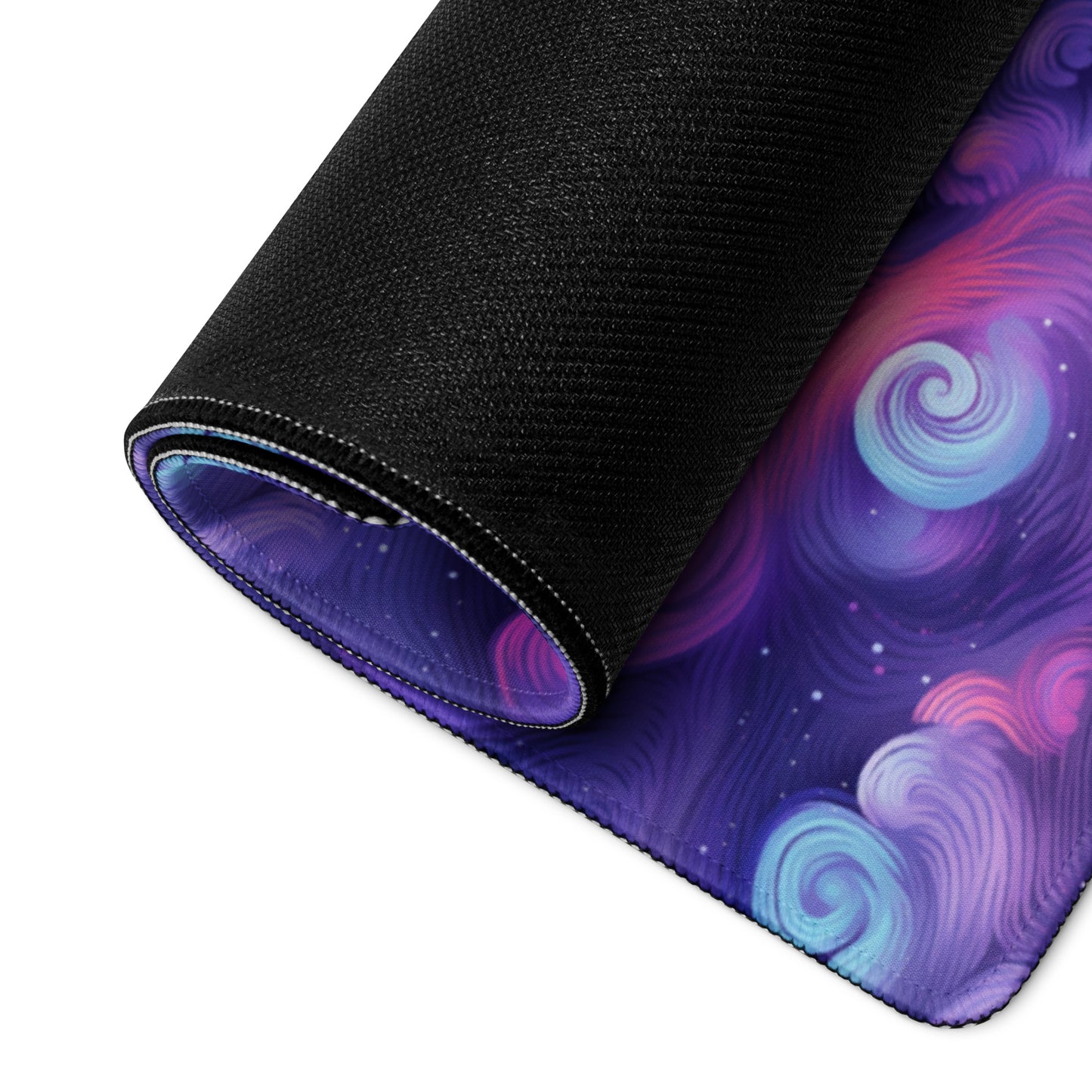 A 36" x 18" desk pad with fluffy clouds and stars on it rolled up. Blue and Purple in color