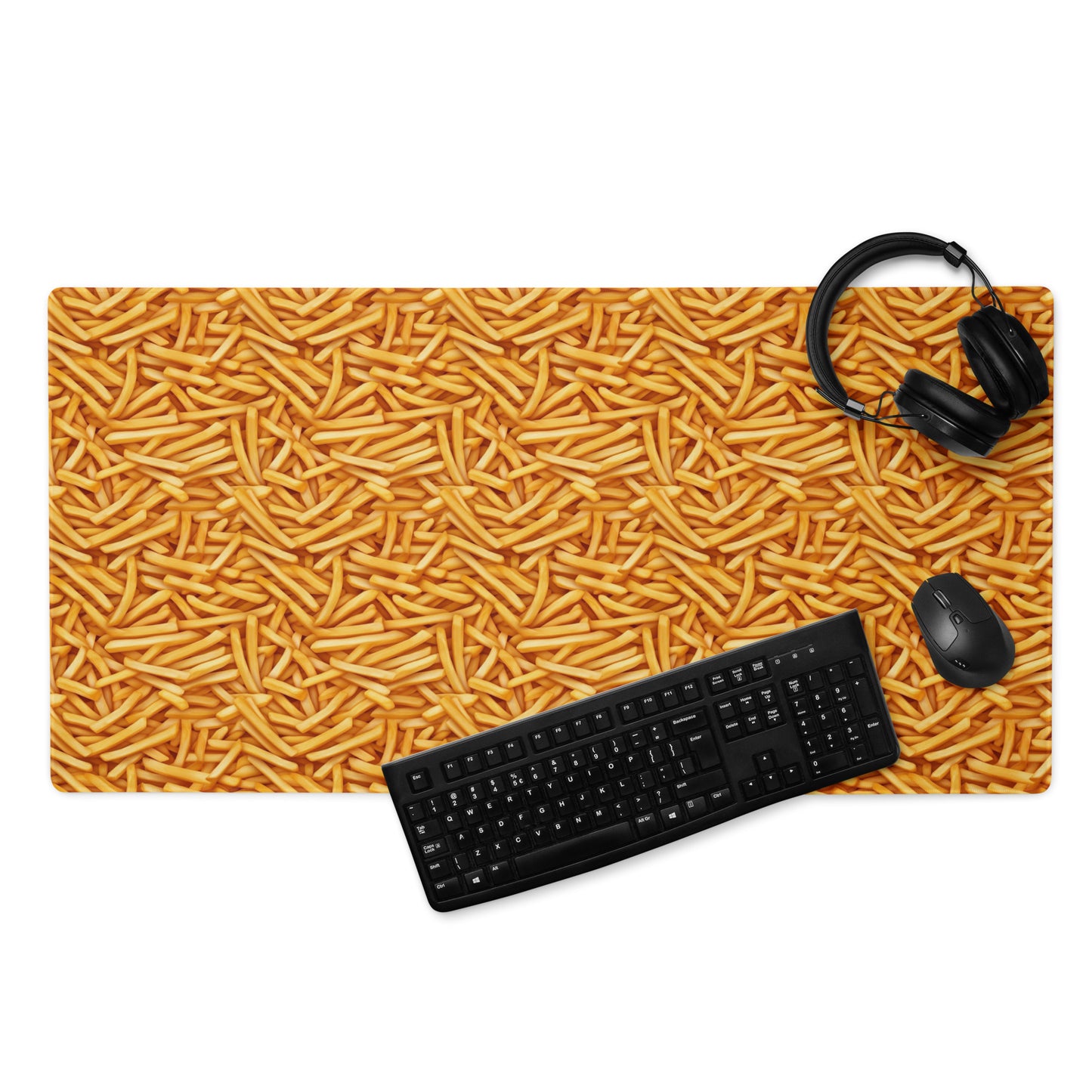 A 36" x 18" desk pad with a bunch of french fries all over it displayed with a keyboard, headphones and a mouse. Yellow in color.