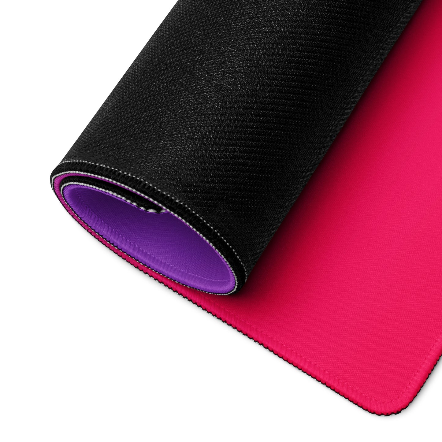 A 36" x 18" desk pad with a brightly colored ice cream cone in the middle of it rolled up. Pink and purple in color.