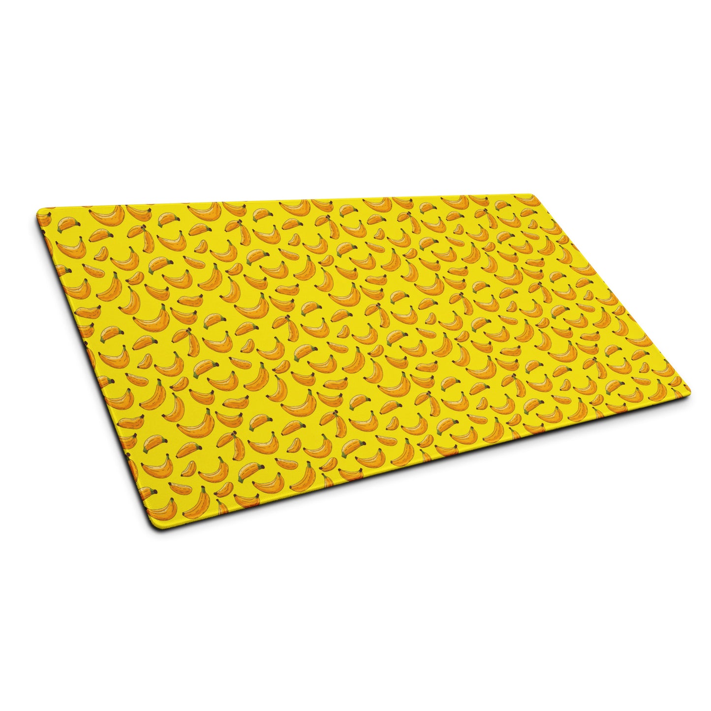 A 36" x 18" desk pad with bananas all over it shown at an angle. Yellow in color.