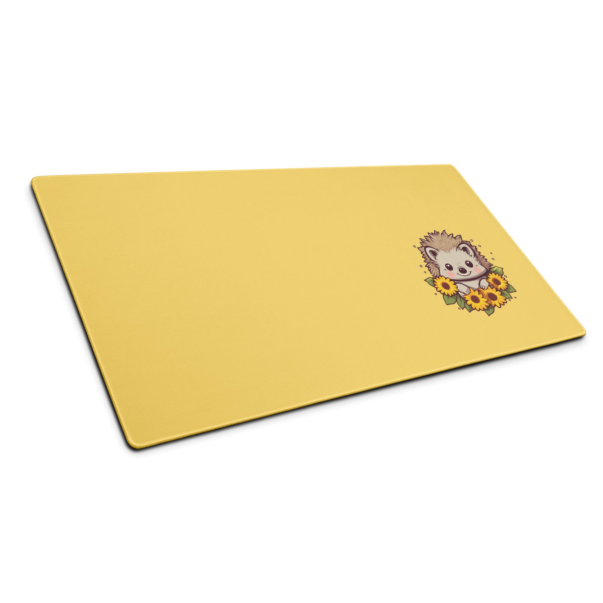 A 36" x 18" desk pad with a cute hedgehog surrounded by sunflowers on it shown at an angle. Yellow in color.