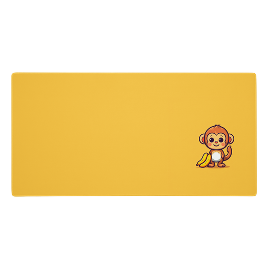 A 36" x 18" desk pad with a cute monkey holding bananas. Yellow in color.