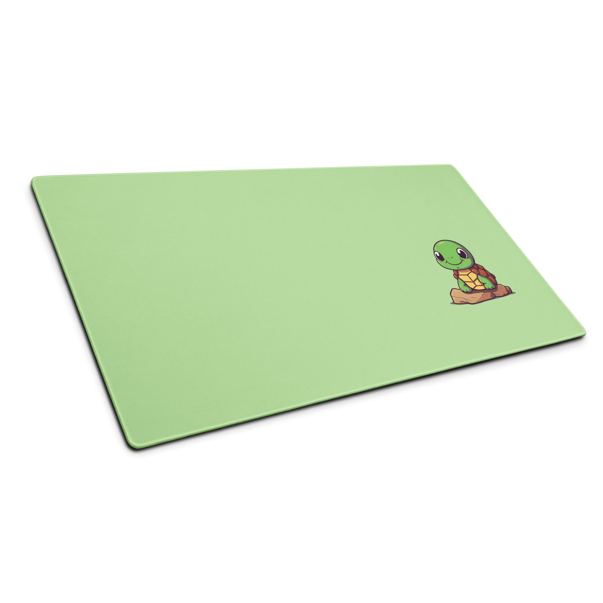A 36" x 18" desk pad with a picture of a cute turtle sitting on a rock shown at an angle. Green in color.