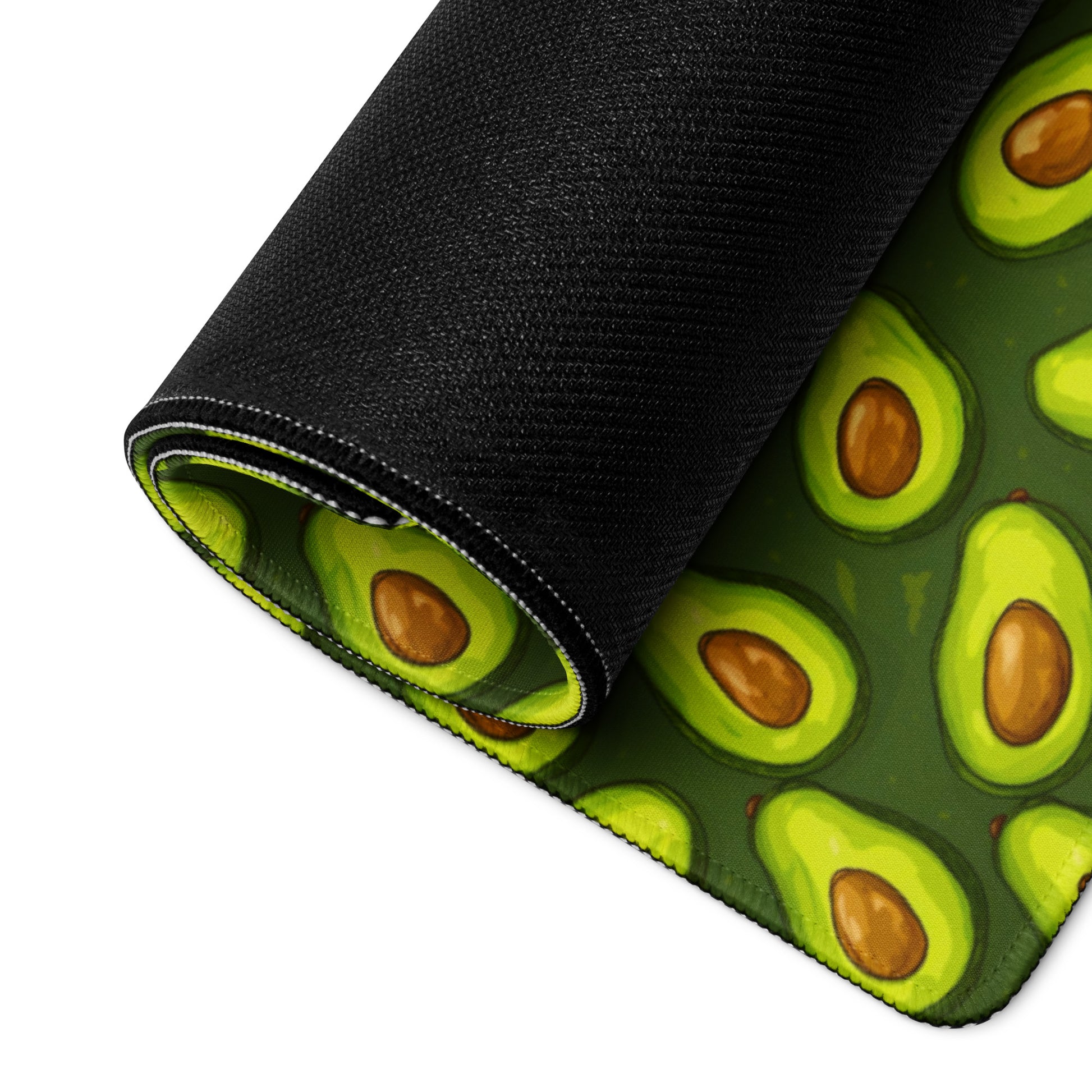 A 36" x 18" desk pad with lots of avocados on it rolled up. Green in color.