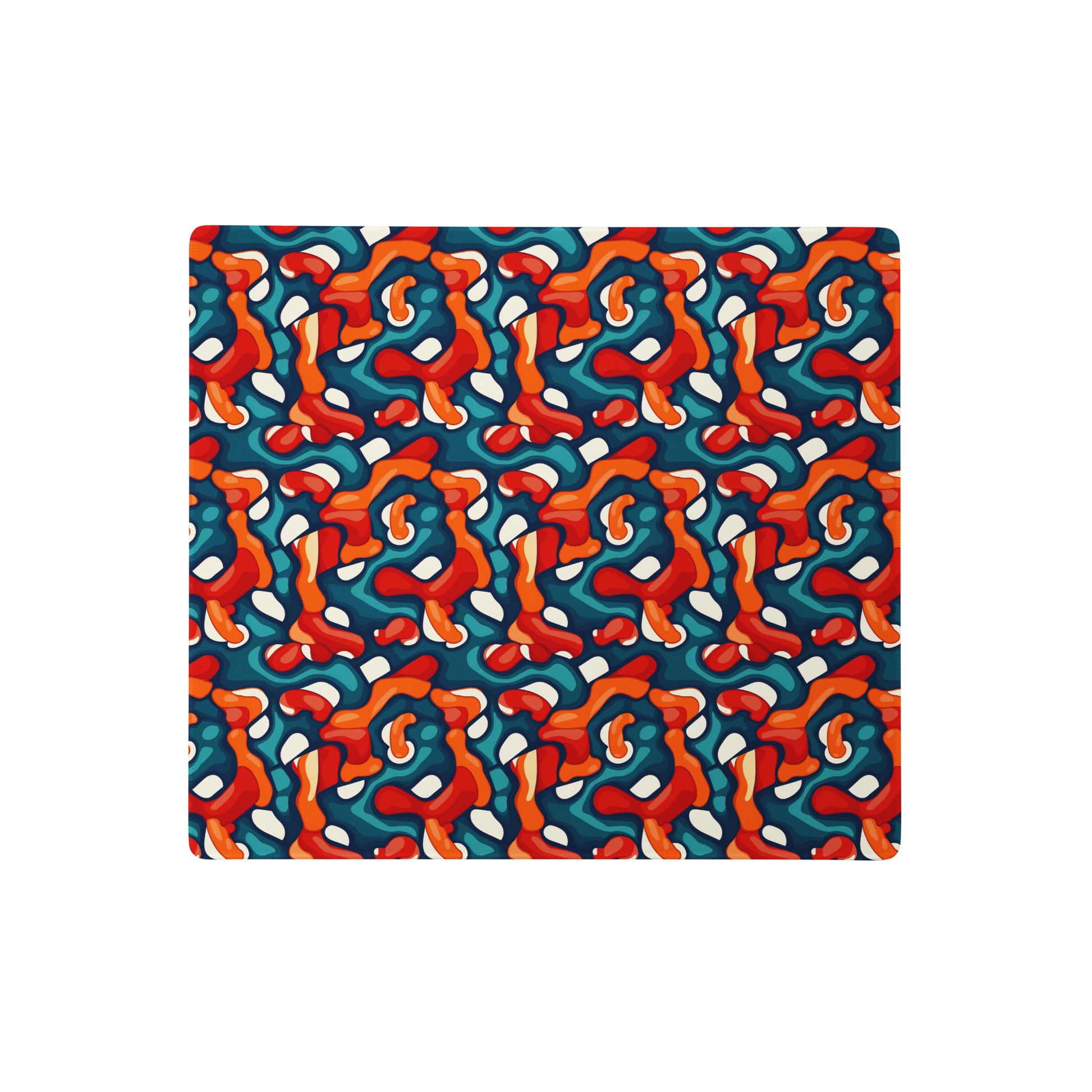 A 18" x 16" desk pad with abstract line art on it. Red, Teal and Orange in color.