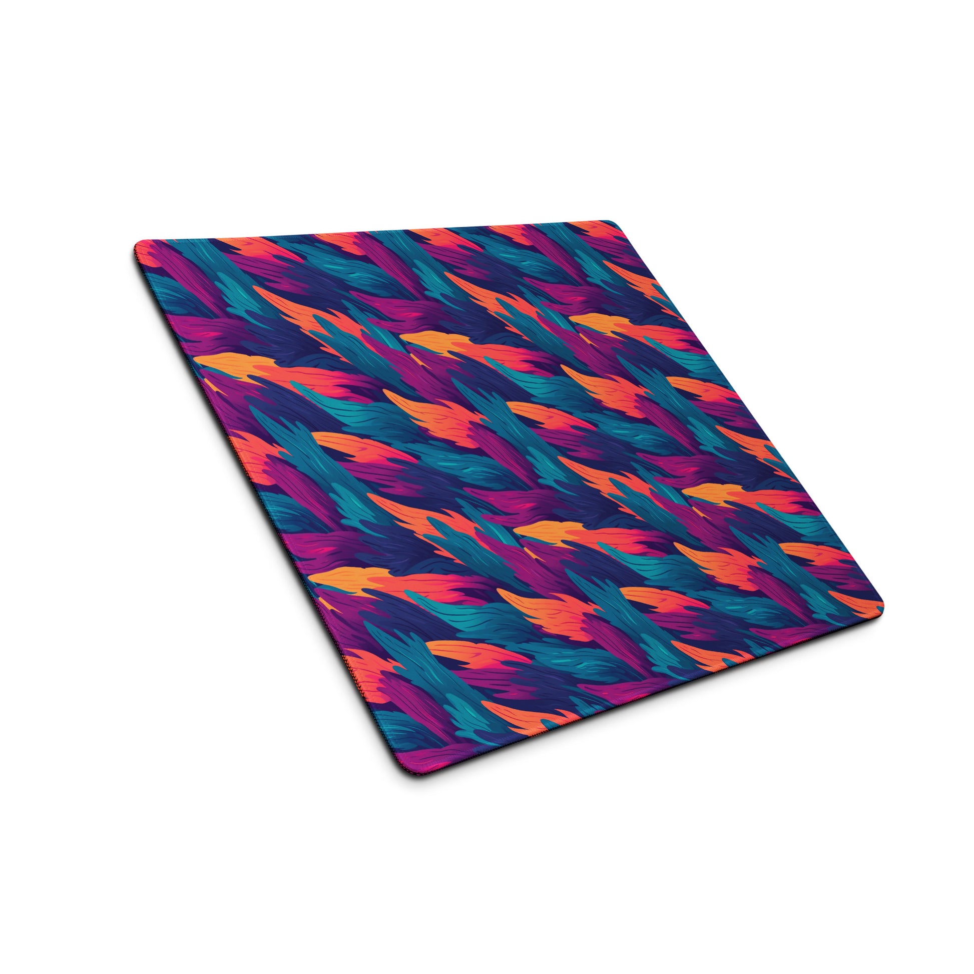 A 18" x 16" desk pad with a wavy flame pattern on it shown at an angle. Blue, Orange and Purple in color.