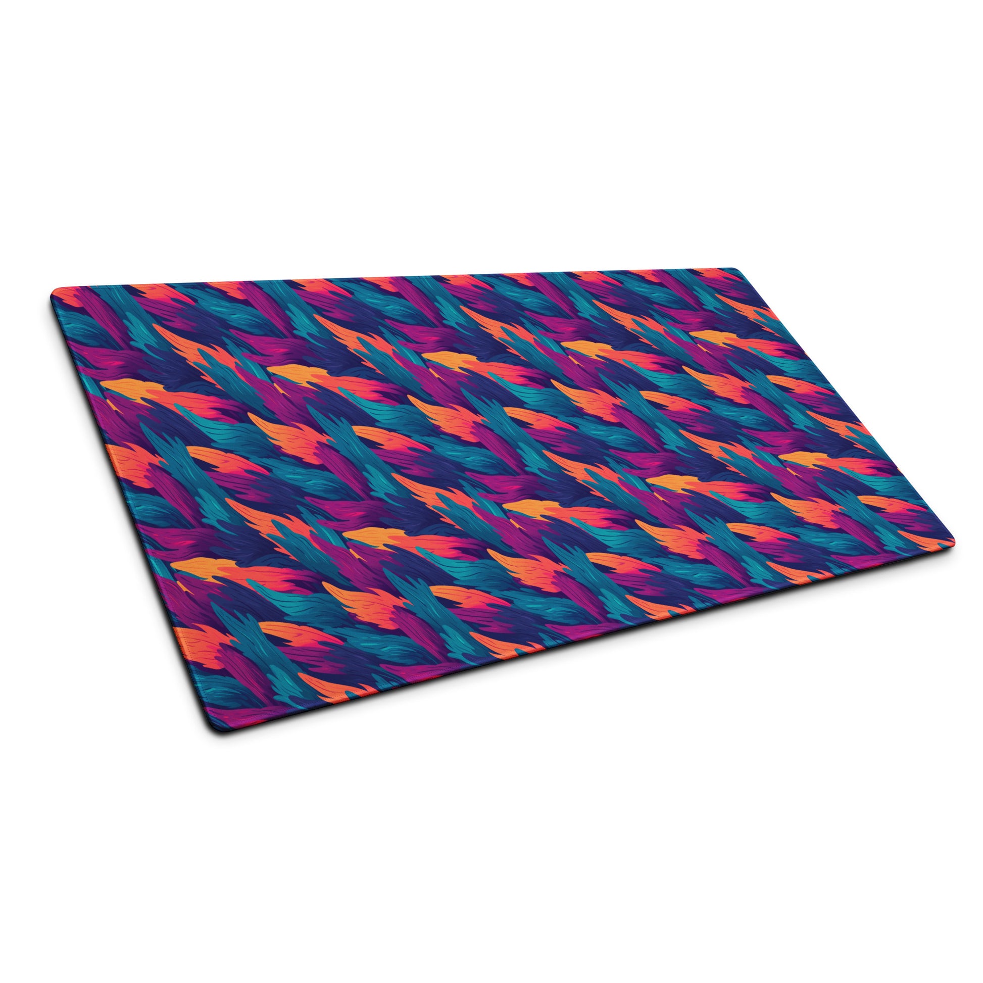 A 36" x 18" desk pad with a wavy flame pattern on it shown at an angle. Blue, Orange and Purple in color.