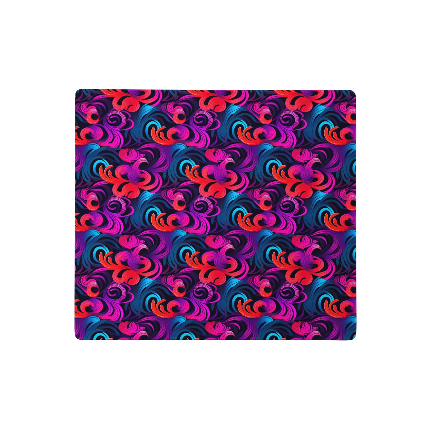 A 18" x 16" desk pad with a bright floral pattern all over it. Blue, Purple and Red in color.