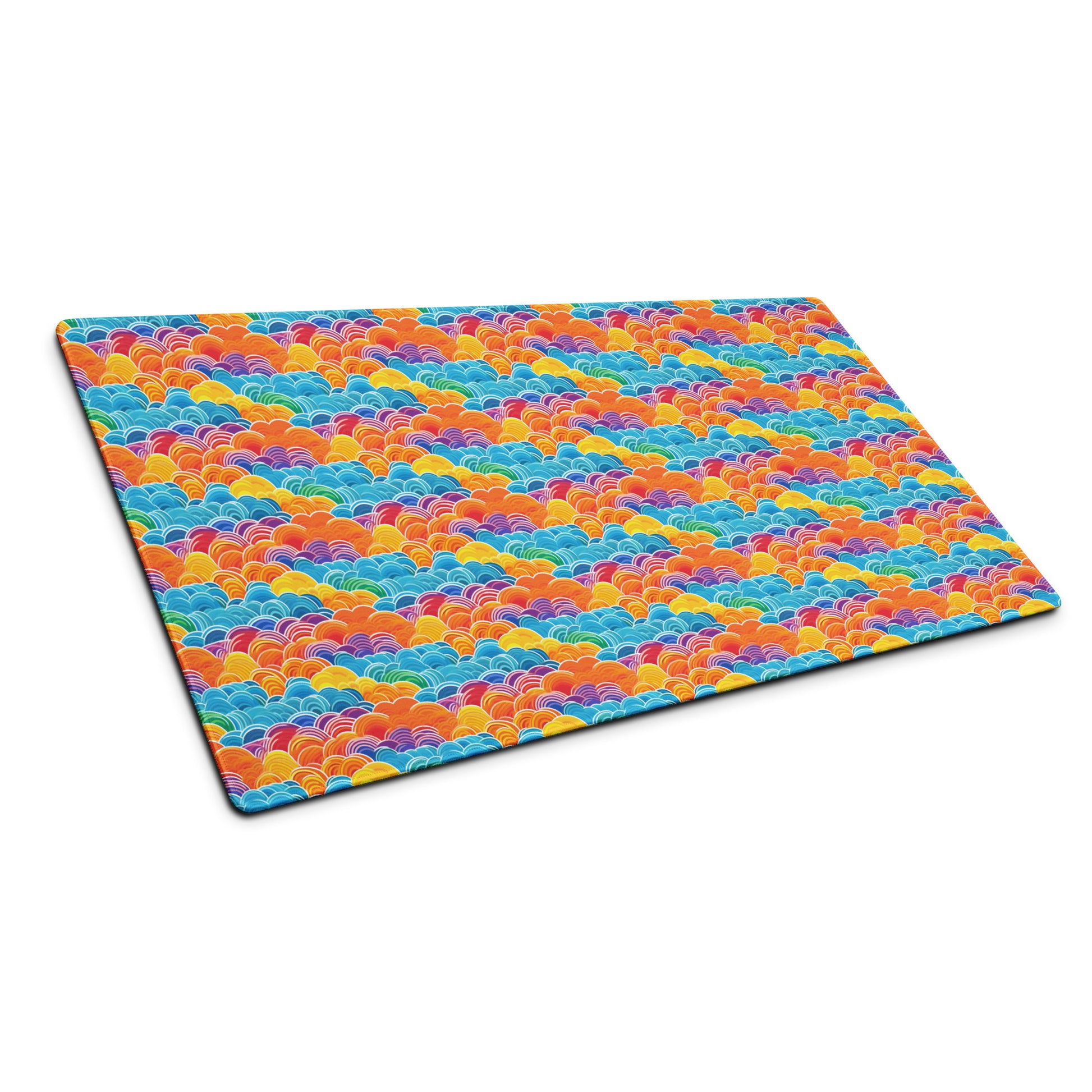A 36" x 18" desk pad with bubbly swirly clouds all over it shown at an angle. Rainbow colored.