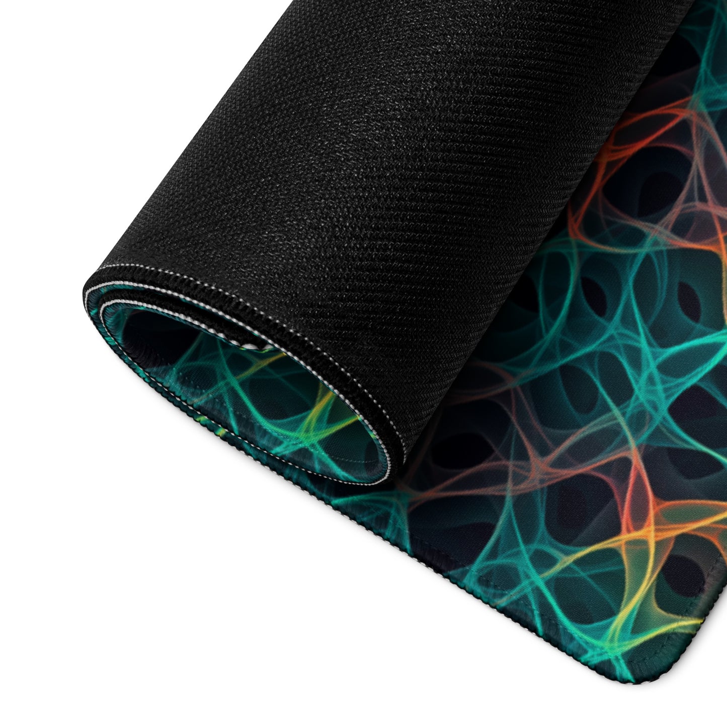 A 36" x 18" desk pad with an abstract pattern resembling a cell structure on it rolled up. Rainbow in color.