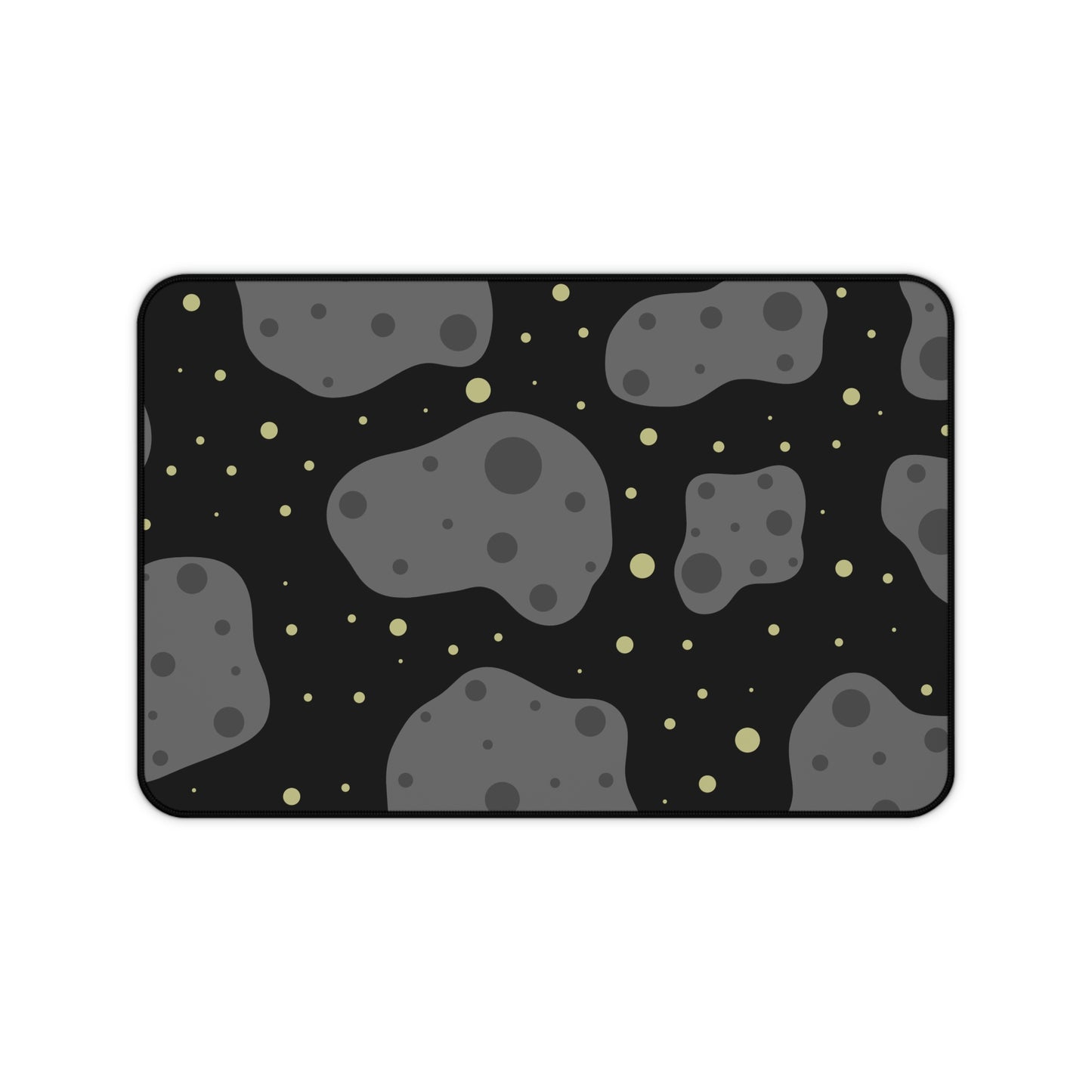 A 12" x 18" desk mat with a black background, gray asteroids, and yellow stars.