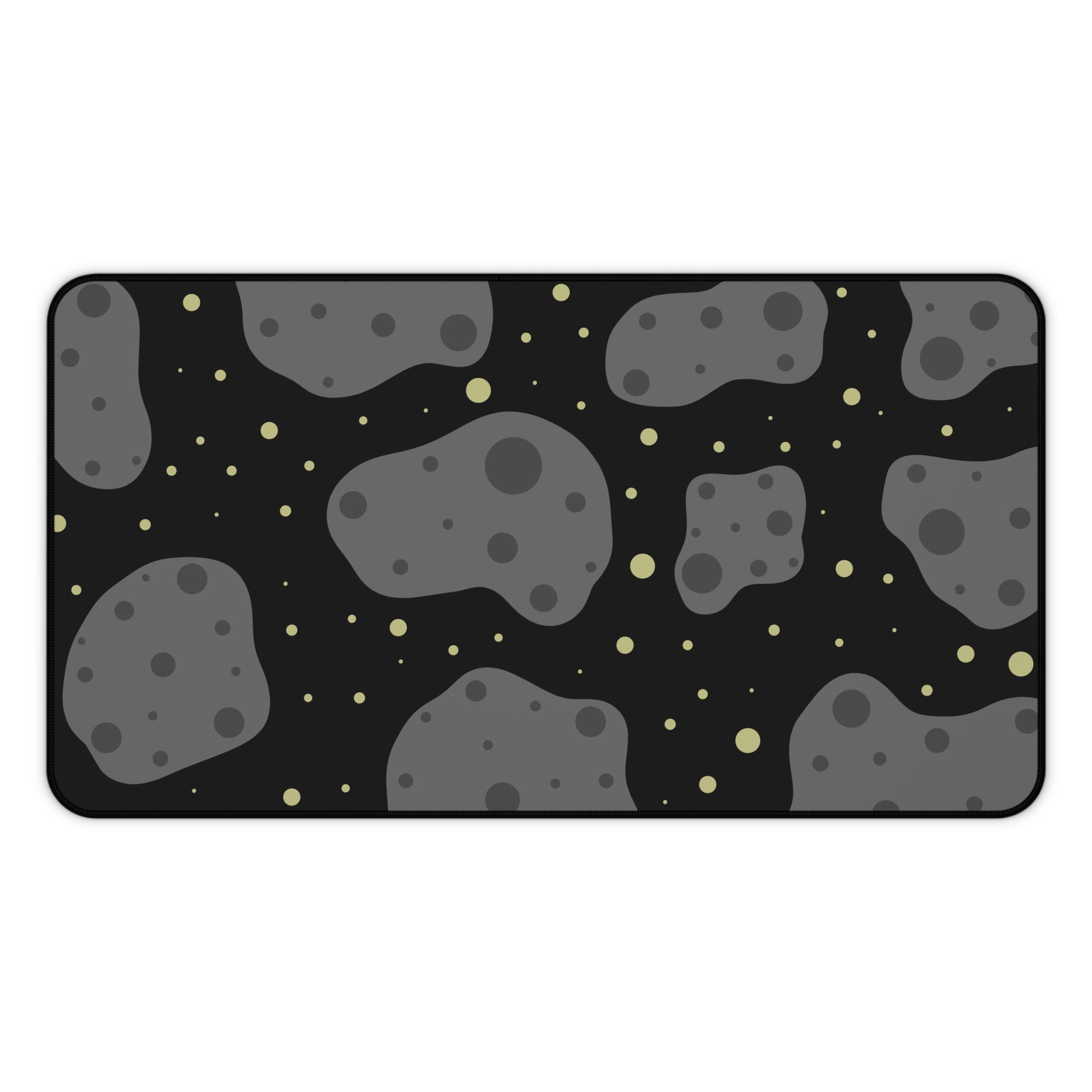 A 12" x 22" desk mat with a black background, gray asteroids, and yellow stars.