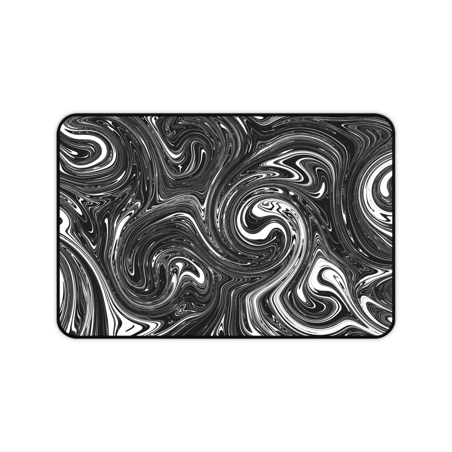 A 12" x 18" desk mat with black and white swirls.