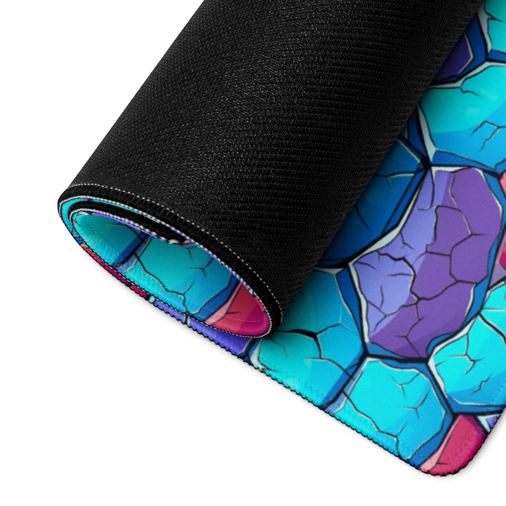 A blue and red crystal gaming desk pad rolled up.