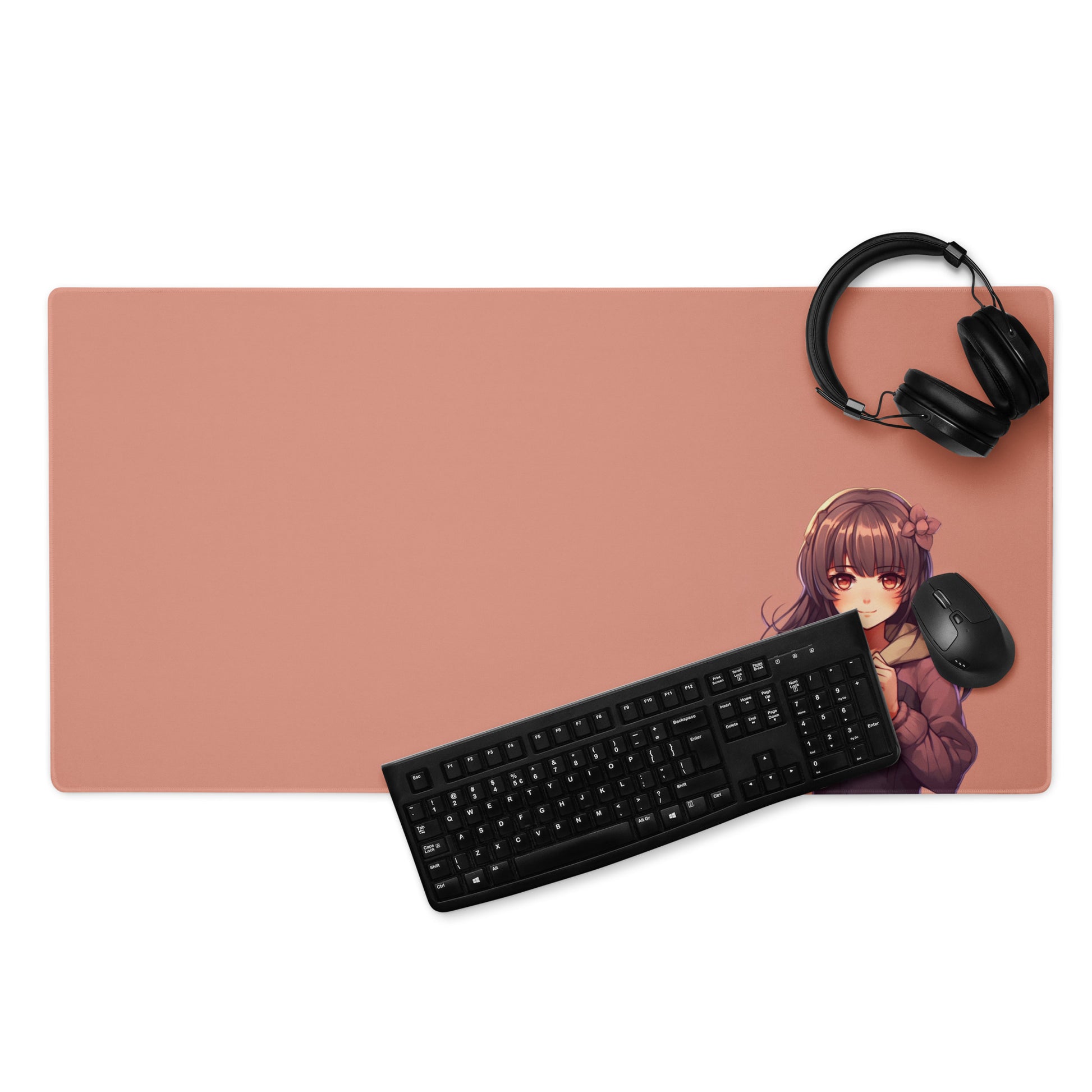 A 36" x 18" gaming desk pad with a blushing anime girl on a rose gold background. A keyboard mouse and headphones sit on top of it.