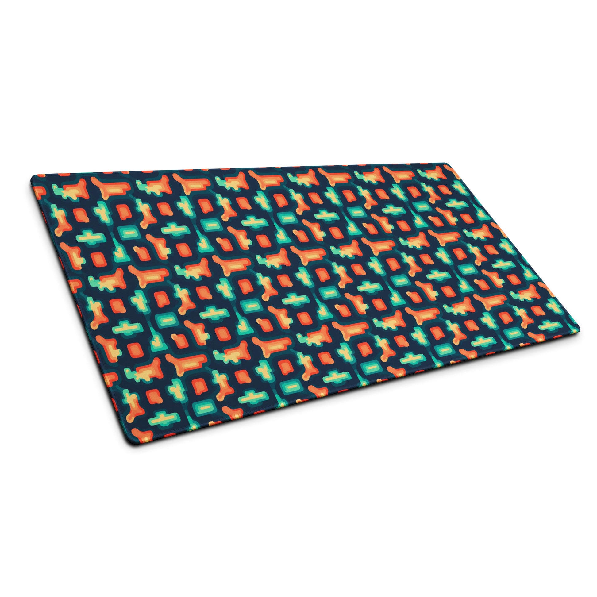 A 36" x 18" gaming desk pad with blue and orange puzzle pieces on a dark blue background sitting at an angle.