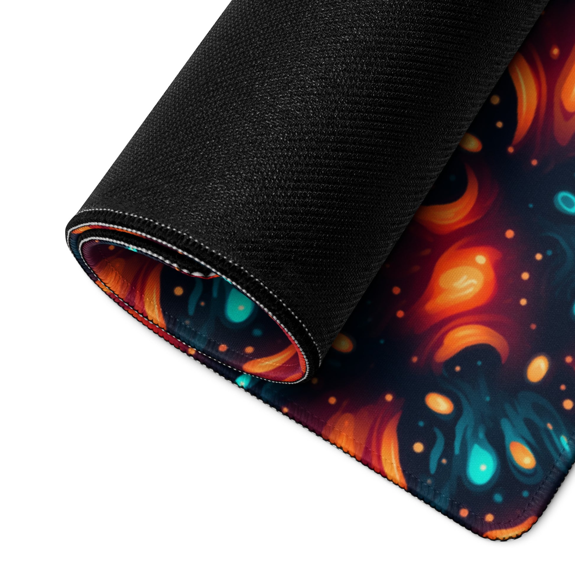 A 36" x 18" desk pad with a blue and orange abstract cross hatch pattern rolled up.